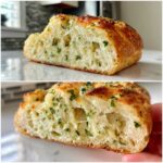 Close-up cross-section showing the airy crumb and melted cheese inside the Italian herb and cheese bread.