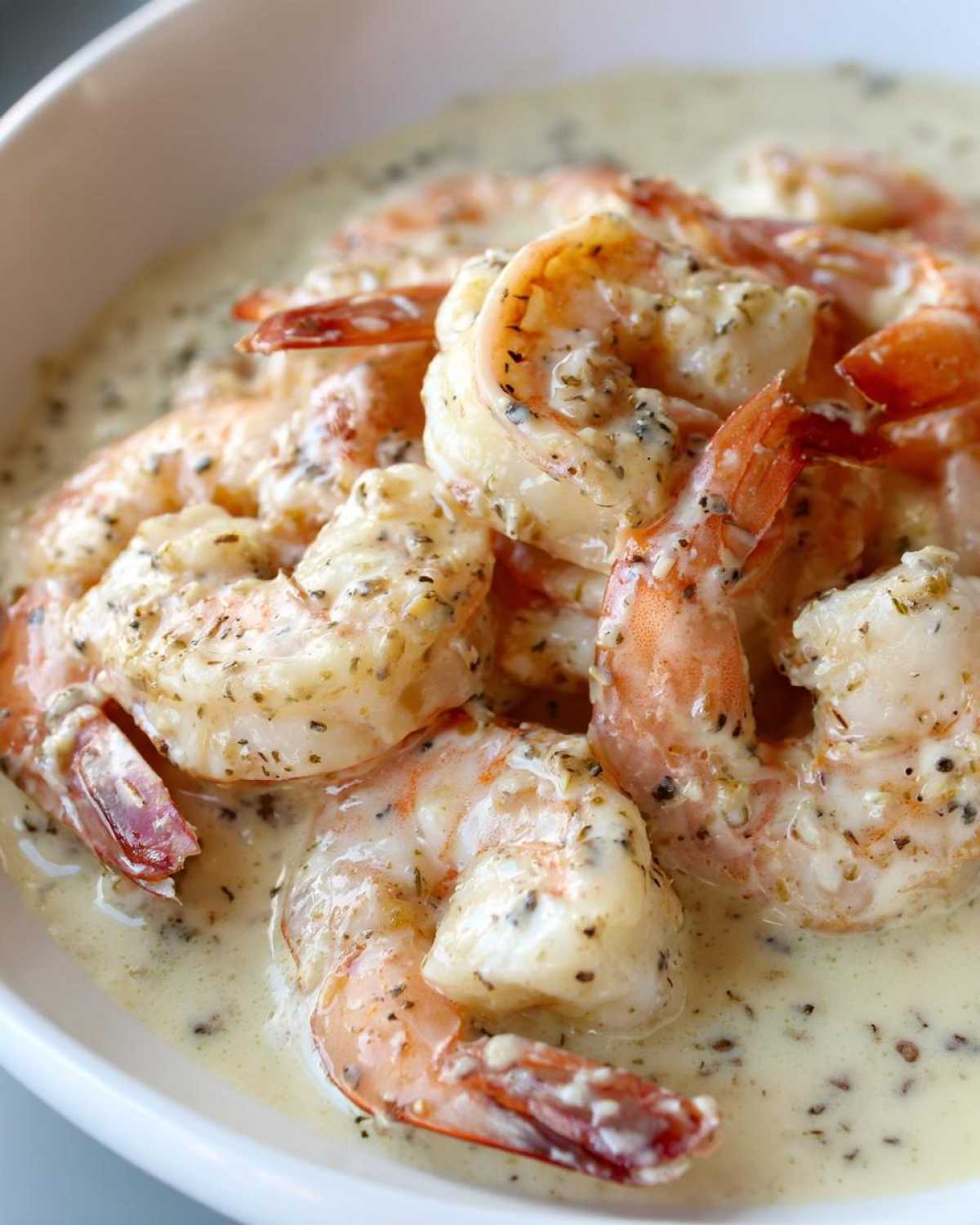 Close-up of succulent shrimp coated in creamy garlic butter sauce, part of Instant Pot Creamy Garlic Butter Shrimp Scampi.