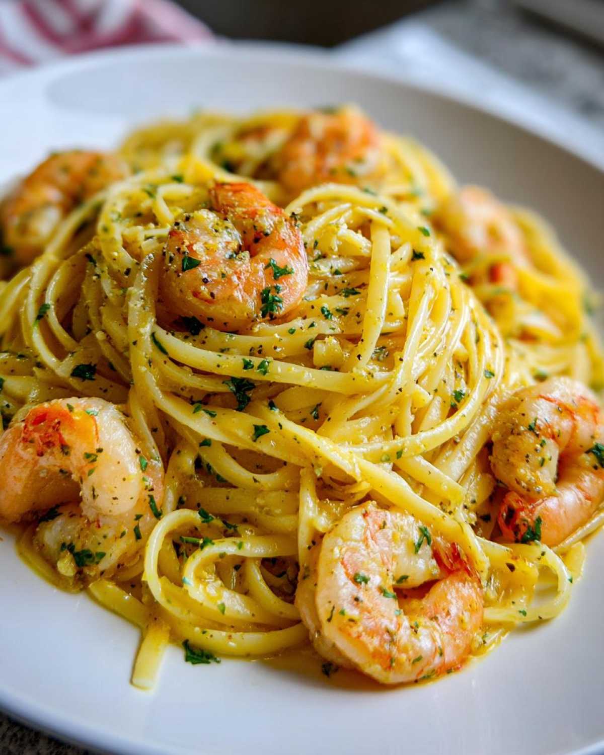 Close-up of linguine tossed in lemon butter sauce with perfectly cooked shrimp, ready for the Lemon Butter Shrimp Pasta.
